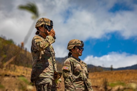 Hawaii Army National Guard Spc. Keana Makai-Dacosin, left, a motor transport operator and Army Spc. Janiele L. Bonilla, an automated logistical specialist, both assigned to Joint Task Force 5-0, observe the mountainside of Lahaina during a fire...