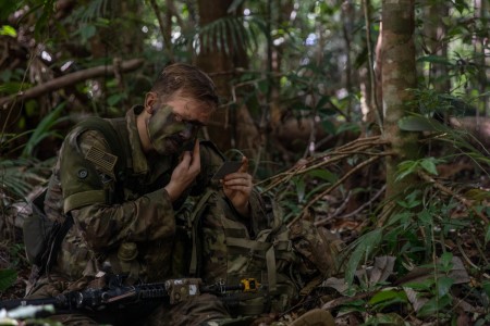 U.S. Army Pfc. Bailey Driskel, a combat engineer assigned to Charlie Company, 1st Battalion, 26th Infantry Regiment, 101st Airborne Division (Air Assault), applies camouflage face paint during the final movement of Exercise Southern Vanguard 24 in...