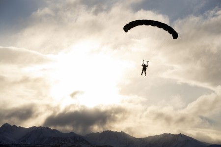 A U.S. Army paratrooper from the 4th Quartermaster Company, 725th Brigade Support Battalion (Airborne), 2nd Infantry Brigade Combat Team (Airborne), 11th Airborne Division, descends over Malemute Drop Zone during military freefall training at...