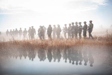 U.S. Army Soldiers assigned to the 4th Infantry Division walk onto a land navigation course in pursuit of the Expert Infantryman, Soldier or Field Medical Badge on Fort Carson, Colorado, Dec. 4, 2023. Land navigation prepares Ivy Soldiers for...