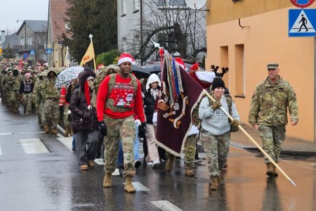 Soldiers of the 47th Brigade Support Battalion, 2nd Armored Brigade Combat Team, 1st Armored Division take part in the annual &#34;Pioneer Rush&#34; ruck march, Dec. 19, 2023. This year&#39;s iteration saw Soldiers delivering gifts to children in...