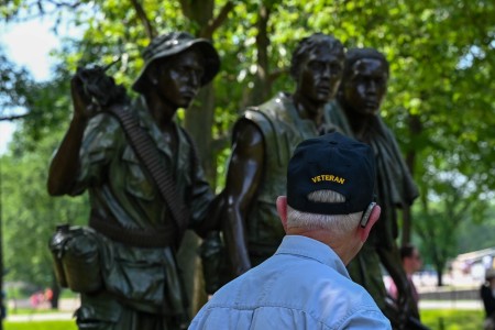 A veteran visits the Three Serviceman Statue, a statue of three Vietnam War Soldiers gazing toward the Memorial Wall of the Vietnam Veterans in Washington, D.C, March 20, 2024. Part of the Vietnam Veterans Memorial, the statue honors those who...