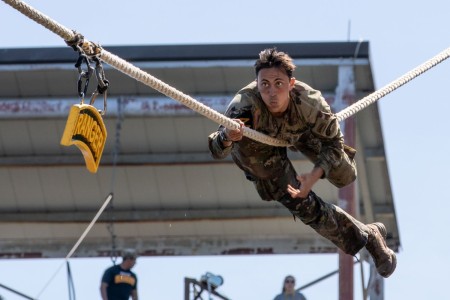 U.S. Army 1st Lt. Collin Johnson, assigned to the 75th Ranger Regiment, climbs across the rope to hit the Ranger tab on day 3 of the Best Ranger Competition, Fort Moore, Georgia, April 14, 2024. The David E. Grange Jr. Best Ranger Competition is a...