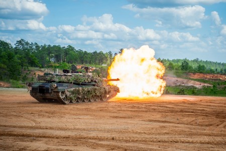 An Abrams tank fires on a simulated enemy position on Red Cloud Range at Fort Moore, Ga., April 27, 2024, during Operation Thunderstrike, a live fire demonstration featuring tanks, Strykers, mortars, drones, and Bradleys. Operation Thunderstrike,...