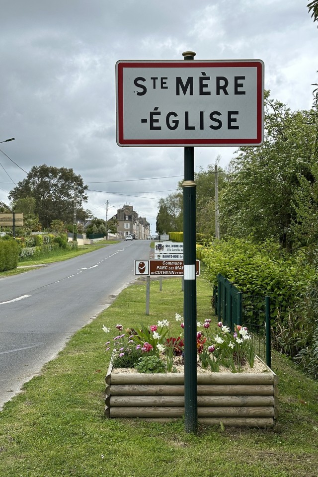 A sign marks the entrance to the town of Sainte-Mere-Eglise in Normandy, France. Photo taken May 3, 2024.