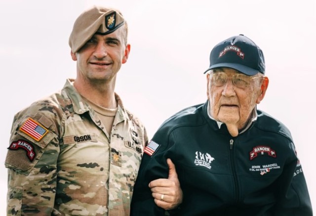 Maj. Jack Gibson stands with John Wardell, the last living member of the 2nd Ranger Battalion from World War II., during an 80th anniversary D-Day commemoration. Gibson&#39;s grandfather served in the same unit during the war and inspired him to...