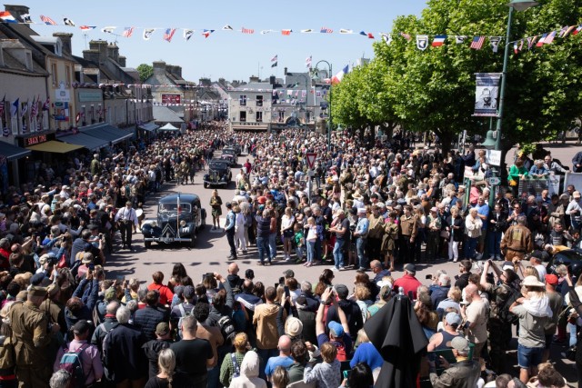 World War II-era vehicles drive through Sainte-Mère-Église to commemorate war efforts as part of D-Day 80 festivities June 2, 2024. Service members, civilians, veterans, and dignitaries have gathered throughout the region to celebrate the events...