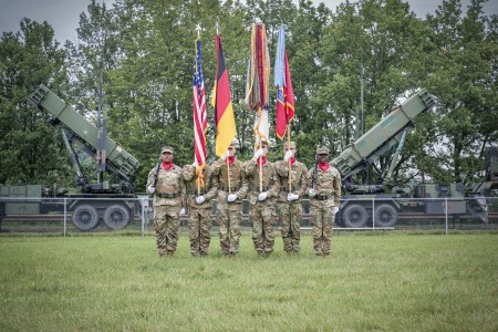 U.S. Army air defenders with 10th AAMDC color guard stand at &#34;attention&#34; in front of Patriot missile system during a change of command ceremony June 20 in Sembach, Germany.