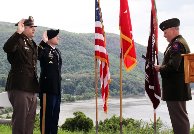 New York Army National Guard 1st Lts. Adrian Smith, left, and John Gamalski are administered the oath of office by Maj. Gen. Michel Natali, the assistant adjutant general, Army for the New York National Guard, at the U.S. Military Academy at West...